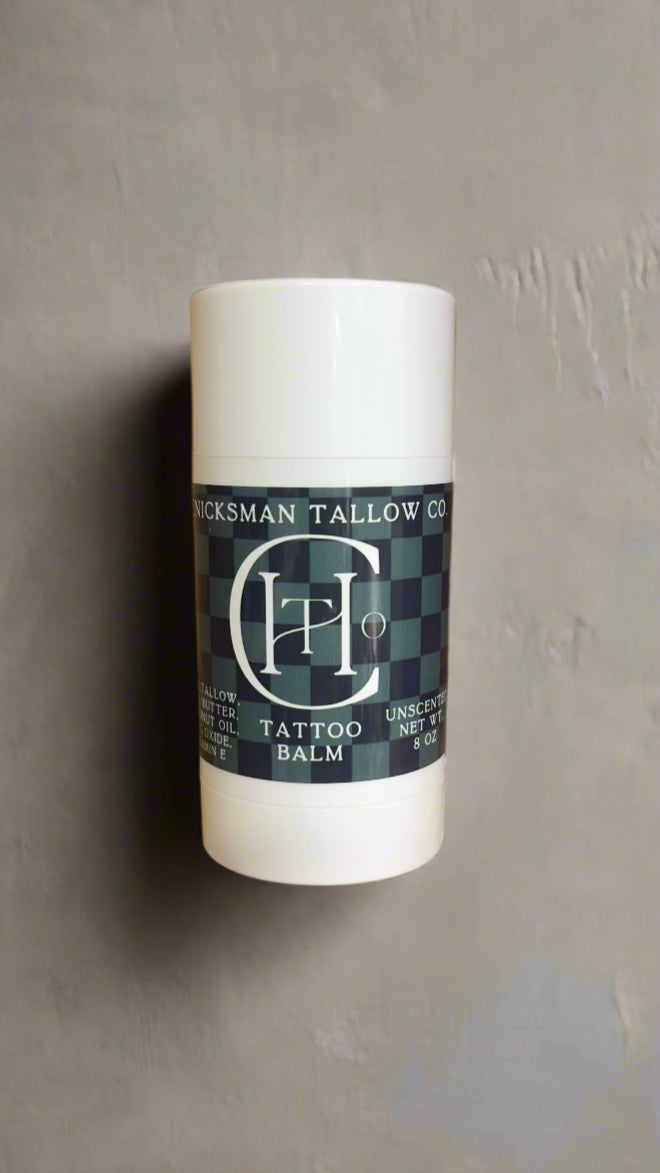 Tattoo balm container with label on a wooden shelf